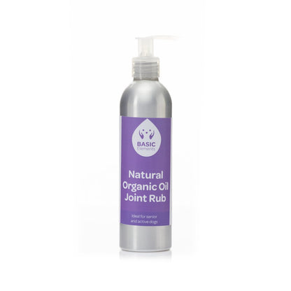 Basic Elements Natural Organic Oil Joint Rub in a silver aluminum pump bottle with a purple label reading “Ideal for senior and active dogs.”